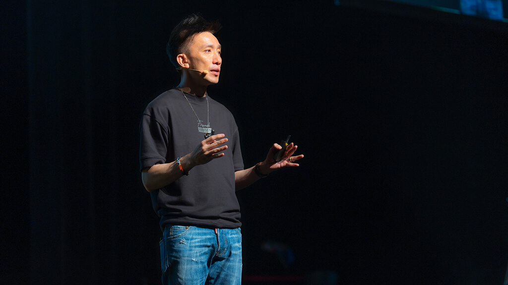 Kelvin Fong presenting on stage