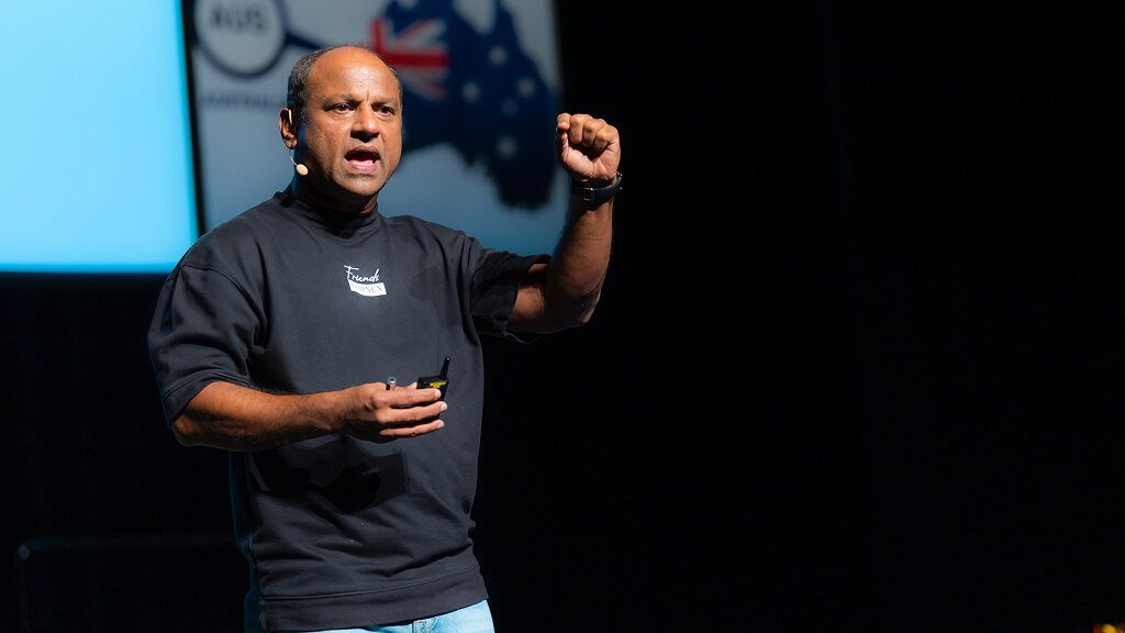 Ismail Gafoor speaking on stage